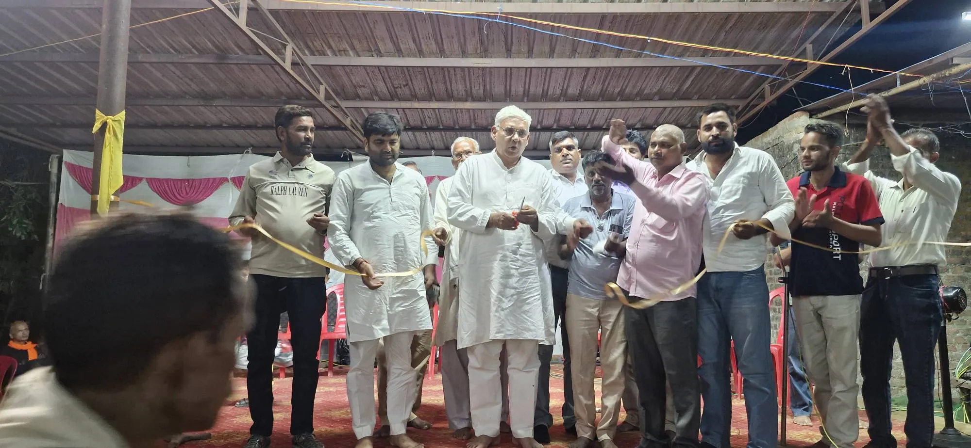 Chandrapal Singh cutting a ribbon with others at the Shri Ram Katha in Bilari
